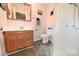 Bathroom with wooden vanity and walk-in shower at 2263 Starbrooke Dr, Newton, NC 28658