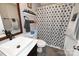 Bathroom with white vanity, framed mirror, and walk-in shower at 2263 Starbrooke Dr, Newton, NC 28658