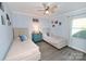 Bedroom with two twin beds, ceiling fan, and side tables at 2263 Starbrooke Dr, Newton, NC 28658