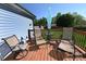 Enjoy the outdoor wooden deck with seating and an umbrella for relaxing on sunny days at 2263 Starbrooke Dr, Newton, NC 28658