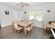 Inviting dining room featuring a wooden table set with seating for four and modern ceiling fan at 2263 Starbrooke Dr, Newton, NC 28658