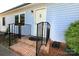 Charming front door with steps, metal railing, and landscaping at 2263 Starbrooke Dr, Newton, NC 28658