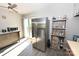 Bright kitchen featuring stainless steel refrigerator, wooden shelving, and sliding glass doors at 2263 Starbrooke Dr, Newton, NC 28658