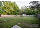 A spacious backyard with a wooden fence and a shed offering ample outdoor space at 2416 Hart Rd, Charlotte, NC 28214