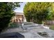 Picturesque backyard with wooden patio and tiered garden beds at 2416 Hart Rd, Charlotte, NC 28214