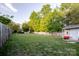 This large fenced backyard with a shed and lush lawn offers great space and privacy at 2416 Hart Rd, Charlotte, NC 28214