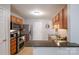 Well-appointed kitchen with stainless steel appliances, wood cabinets, and a breakfast bar, creating a functional layout at 2416 Hart Rd, Charlotte, NC 28214