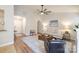 Open-concept living room with wood floors, neutral paint and a comfortable seating arrangement around a central ottoman at 2416 Hart Rd, Charlotte, NC 28214