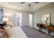 Comfortable main bedroom with a ceiling fan, ensuite bathroom, and accent furniture at 2416 Hart Rd, Charlotte, NC 28214