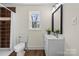Bathroom with a large, framed mirror and bright white vanity at 2609 Lowell Rd, Gastonia, NC 28054