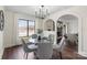 Bright dining area features modern chandelier, hardwood floors, and neutral paint at 2609 Lowell Rd, Gastonia, NC 28054