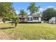 Inviting single-story home featuring a classic design and a lush green lawn at 2609 Lowell Rd, Gastonia, NC 28054