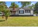 Charming single-story home with a brick chimney and a well-manicured front lawn at 2609 Lowell Rd, Gastonia, NC 28054