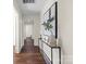 Long hallway features modern decor, hardwood floors, and access to other rooms at 2609 Lowell Rd, Gastonia, NC 28054
