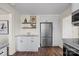 Bright kitchen features white cabinets, stainless steel appliances, granite countertops, and open shelving at 2609 Lowell Rd, Gastonia, NC 28054