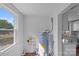 Bright utility room with water heater and view of the backyard at 2609 Lowell Rd, Gastonia, NC 28054