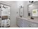 Charming bathroom with double vanity featuring marble countertops and access to the adjacent room at 2841 Attaberry Dr, Charlotte, NC 28205