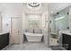 Elegant bathroom featuring a standalone tub, walk-in shower, and stylish vanity at 2841 Attaberry Dr, Charlotte, NC 28205