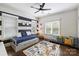 Bright bedroom offers modern decor, with a daybed, colorful pillows, and a stylish patterned rug at 2841 Attaberry Dr, Charlotte, NC 28205