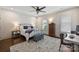 Comfortable bedroom with neutral decor, a ceiling fan, and desk space at 2841 Attaberry Dr, Charlotte, NC 28205