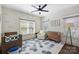 Well-lit Bedroom, complete with a hexagon patterned rug, crib, dresser, and comfy chair at 2841 Attaberry Dr, Charlotte, NC 28205