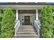 Inviting front entrance with stone steps, elegant columns, and a beautiful wooden door at 2841 Attaberry Dr, Charlotte, NC 28205