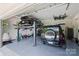 Spacious garage with car lift, and room for parking, tool storage, and hobbies at 2841 Attaberry Dr, Charlotte, NC 28205