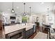 Open-concept kitchen with a large island, stainless steel appliances, and hardwood floors at 2841 Attaberry Dr, Charlotte, NC 28205