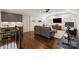 Spacious upstairs living room with wet bar, dark wood flooring, and comfortable seating area at 2841 Attaberry Dr, Charlotte, NC 28205