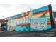 Colorful mural featuring 'Plaza Midwood' and 'Calle Sol Latin Cafe' on building exterior at 2841 Attaberry Dr, Charlotte, NC 28205