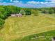 Expansive lot featuring a well-maintained lawn and an inviting single-Gathering home near a quiet country road at 286 Bell Farm Rd, Statesville, NC 28625