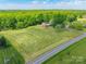 A charming single-Gathering home with a large lawn near a quiet country road surrounded by mature trees at 286 Bell Farm Rd, Statesville, NC 28625