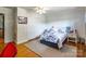 Inviting bedroom with hardwood floors, ceiling fan, ample closet space, and a calm atmosphere at 286 Bell Farm Rd, Statesville, NC 28625