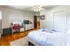Functional bedroom features hardwood floors, neutral decor, closet, desk, and natural light at 286 Bell Farm Rd, Statesville, NC 28625