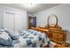 Relaxing bedroom with a wooden sleigh bed, hardwood floors, vintage dresser, and closet at 286 Bell Farm Rd, Statesville, NC 28625