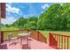 Outdoor deck with seating area showcasing serene views of the backyard and lush green trees at 286 Bell Farm Rd, Statesville, NC 28625