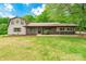 Charming two-story home with a spacious front lawn and metal roof at 286 Bell Farm Rd, Statesville, NC 28625