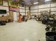 Large garage with high ceilings, and open space for parking, projects, and organizing tools and equipment at 286 Bell Farm Rd, Statesville, NC 28625