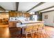 Eat-in kitchen boasts hardwood floors, wood beams, an island, and lots of cabinet space at 286 Bell Farm Rd, Statesville, NC 28625