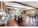 Open-concept kitchen featuring wood floors, and an eat-in island at 286 Bell Farm Rd, Statesville, NC 28625