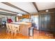 The kitchen has wood cabinets, an island with seating, and stainless steel appliances at 286 Bell Farm Rd, Statesville, NC 28625
