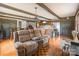 Spacious living room with wood flooring, wood beams, and lots of natural light at 286 Bell Farm Rd, Statesville, NC 28625