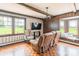This living room has wood floors, natural light, wood paneling, and a TV at 286 Bell Farm Rd, Statesville, NC 28625