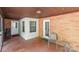 Inviting covered patio with brick wall and decorative tile, offering a cozy outdoor space at 286 Bell Farm Rd, Statesville, NC 28625