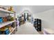 Finished attic space with storage shelves, a desk area, and plenty of natural light at 2936 Shumard Dr, Gastonia, NC 28054