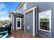 Back deck offers outdoor seating, a grill, and views of the landscaped yard at 2936 Shumard Dr, Gastonia, NC 28054