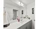 Bright bathroom with modern vanity, sleek fixtures, decorative wall art, and a large mirror at 2936 Shumard Dr, Gastonia, NC 28054