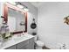 Charming half bathroom with stylish vanity, modern fixtures, and shiplap accent wall, offering a blend of comfort and design at 2936 Shumard Dr, Gastonia, NC 28054