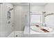 Luxurious bathroom featuring a glass-enclosed shower and a relaxing soaking tub, offering a spa-like experience at home at 2936 Shumard Dr, Gastonia, NC 28054