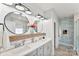 Modern bathroom with double vanity, stylish mirrors, and a blend of textures, creating an elegant and functional space at 2936 Shumard Dr, Gastonia, NC 28054